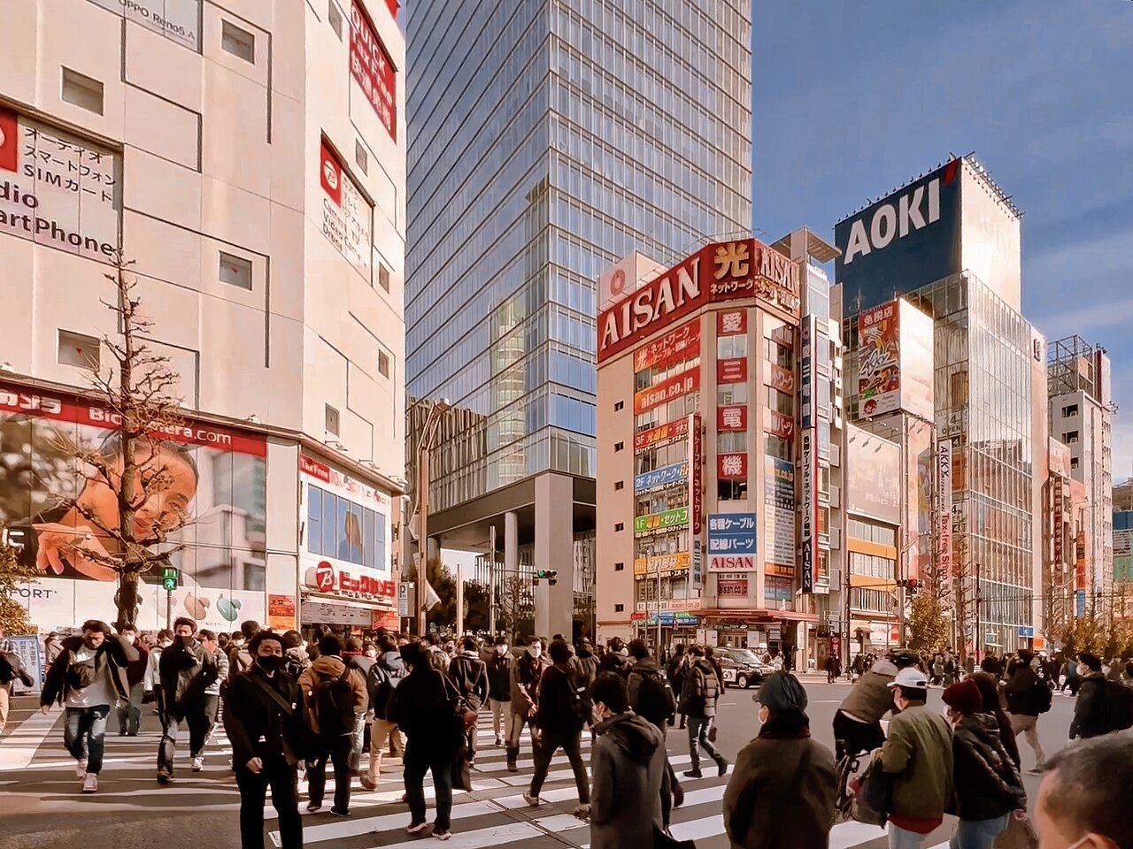 Pedestrians and colorful buildings in Akihabara, Tokyo